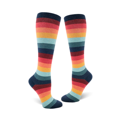 Pair of women's knee-high socks in a retro rainbow stripe pattern. Colors include teal, orange, red, and dark blue.