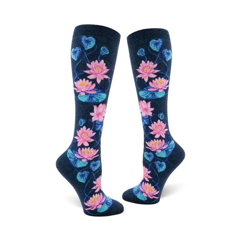 Pair of navy blue knee-high socks with a pattern of pink and teal lotus flowers and leaves.