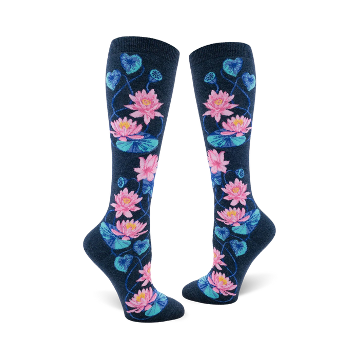 Pair of navy blue knee-high socks with a pattern of pink and teal lotus flowers and leaves. }}