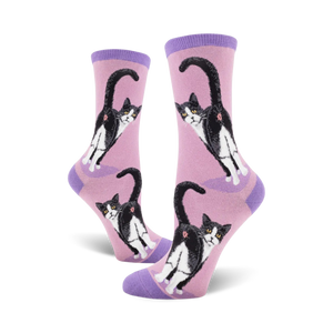 Pair of women's crew socks, pink and purple, featuring a repeated pattern of tuxedo cats' backsides.