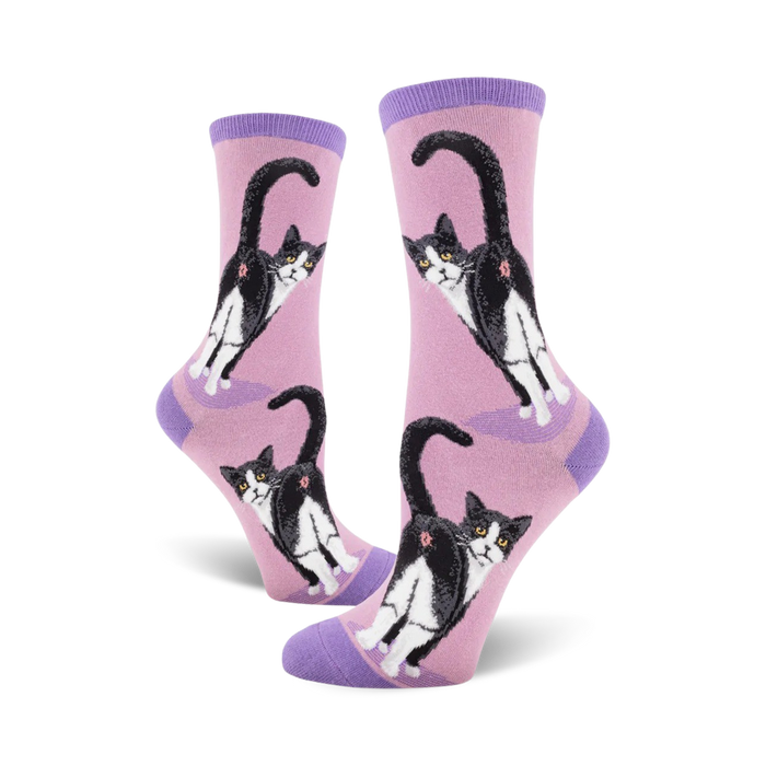 pink crew socks with a fun pattern of black and white tuxedo cat butts.   