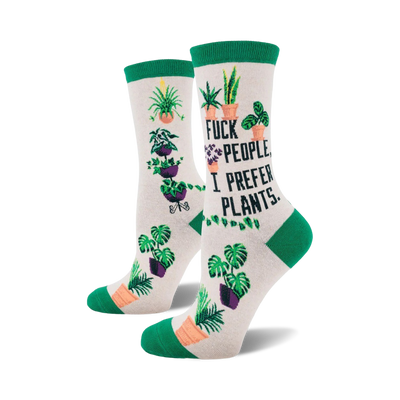Cream crew socks with green cuffs. Feature various potted plants and the phrase 'F*ck people, I prefer plants'.