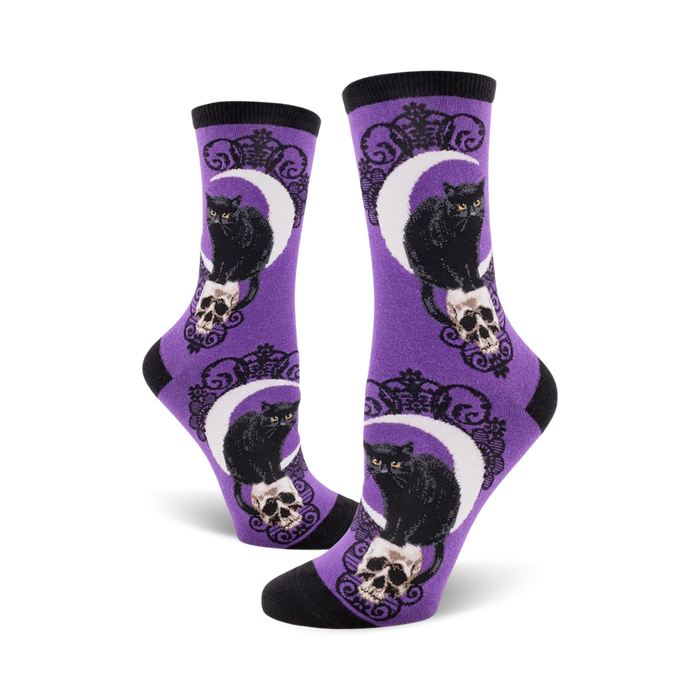 Lifestyle shot showing the purple Black Cat Moon socks on a model's feet.