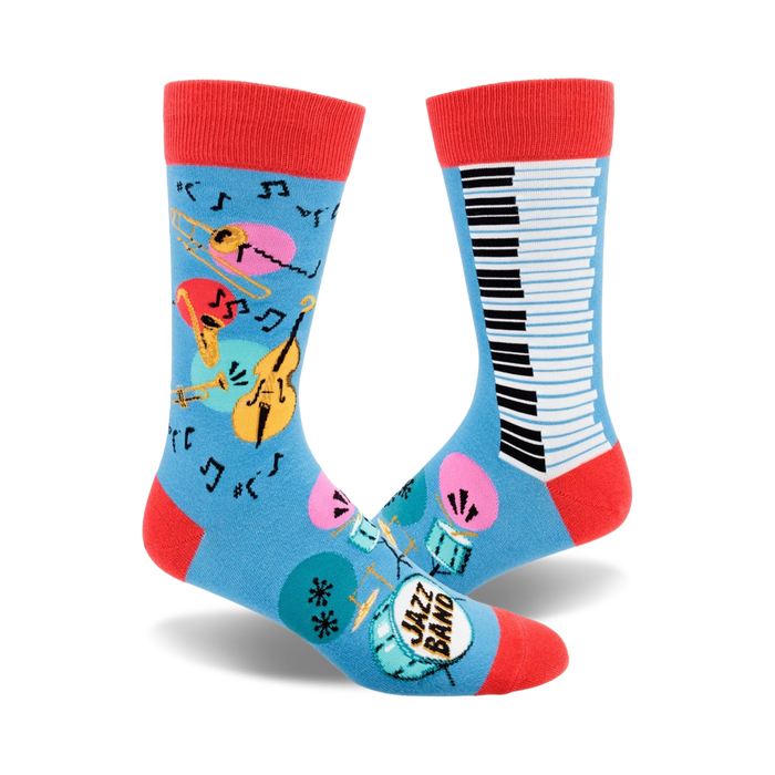 Crew socks in blue with red cuffs. Features a piano keyboard, musical instruments (trumpet, cello), and music notes. }}