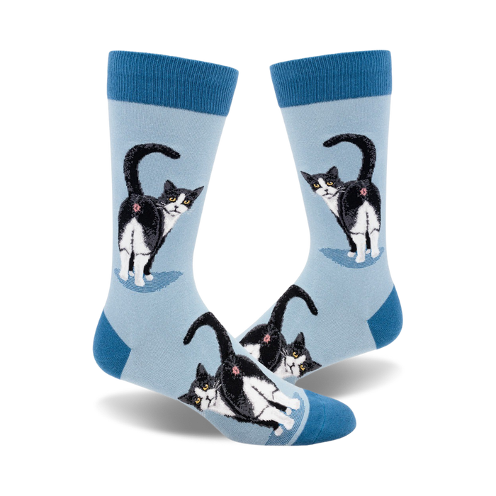 Lifestyle shot of Tuxedo Cat Butt socks on a person's feet, showing off the socks' fit and design.