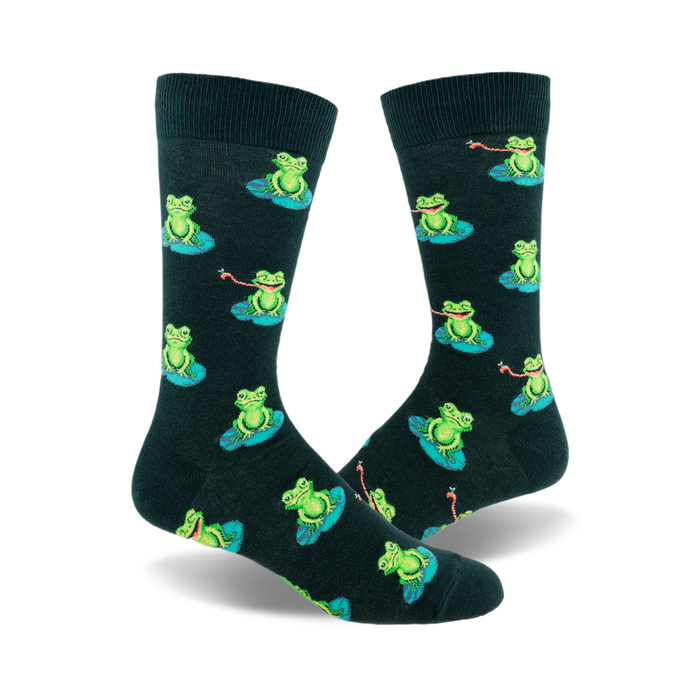 A pair of dark green crew socks with a repeating pattern of green frogs sitting on lily pads and catching flies with their tongues. }}