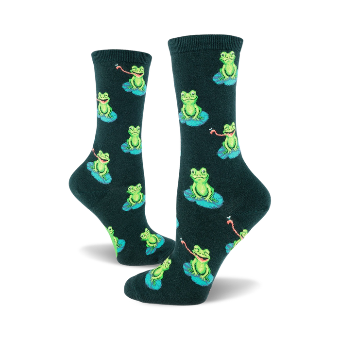 Pair of dark green crew socks with a repeating pattern of smiling green frogs sitting on lily pads and catching flies. }}