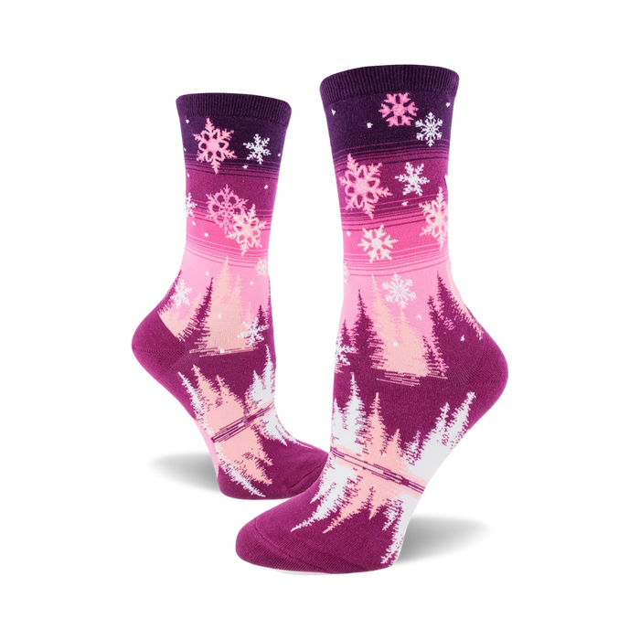Women's crew socks in pink and purple ombre. Design features snowflakes and stylized winter trees. }}