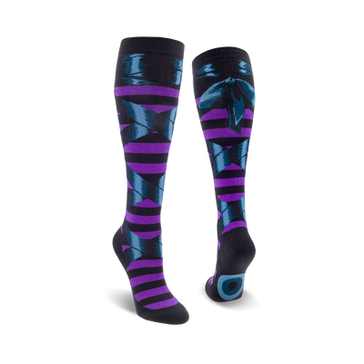 A pair of knee-high socks in purple and teal.  The socks feature a striped pattern and a dark teal bow design.