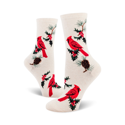 Cream crew socks with a pattern of red cardinals, holly sprigs, and pine cones.  A classic holiday design for cozy comfort.