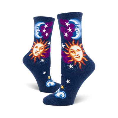 Pair of navy blue crew socks with whimsical sun, moon, stars, and clouds. The sun and moon have smiling faces.