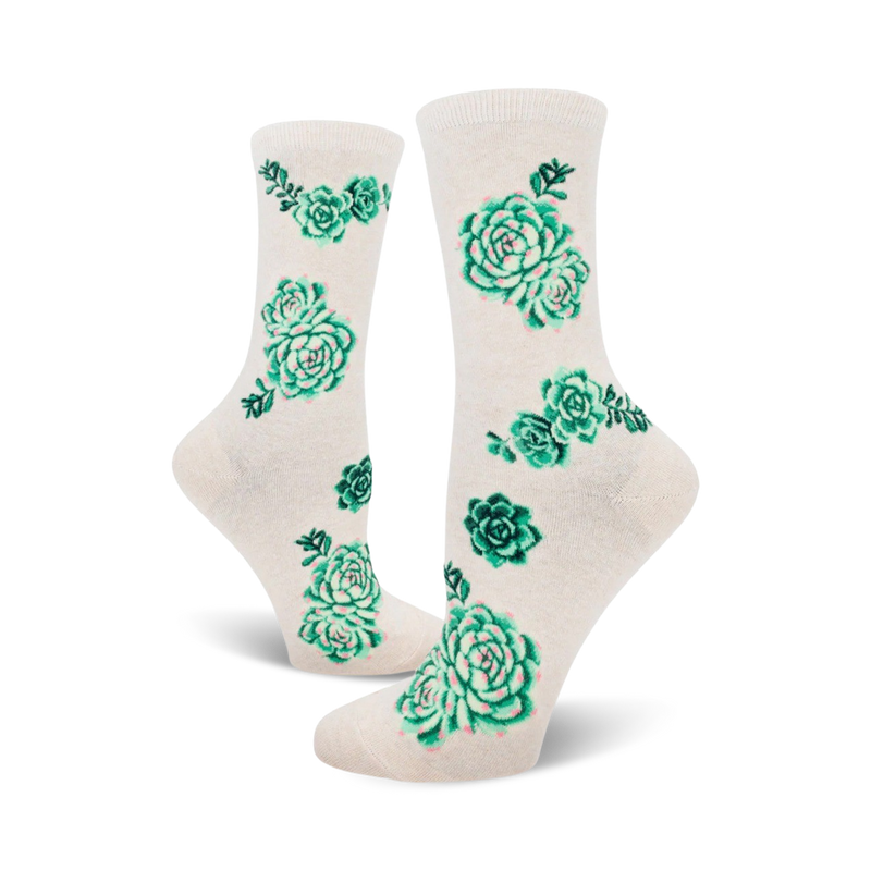 Cream and pink crew socks with a scattered pattern of green succulents. A fun, botanical design.