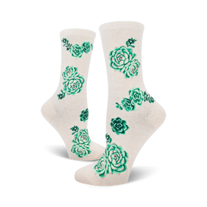Cream and pink crew socks with a scattered pattern of green succulents.  A fun, botanical design.
