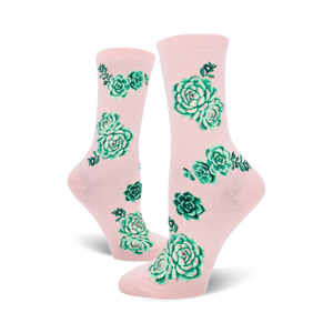 pink crew socks for women designed with a pattern of green succulents in various shapes, sizes, and shades of green.   