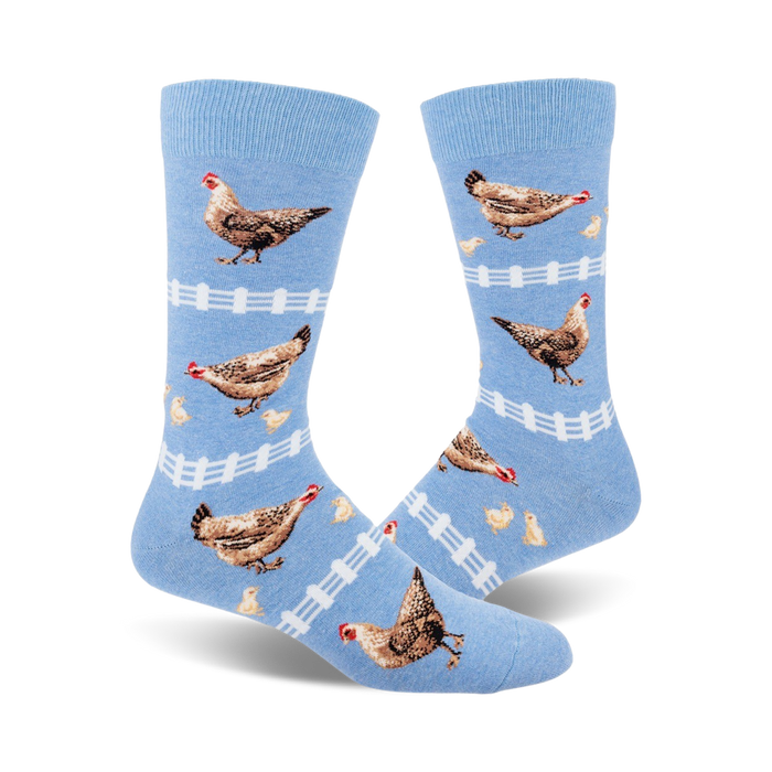 mens crew socks with a pattern of brown chickens with red combs and yellow beaks in front of a white picket fence with yellow chicks.    }}