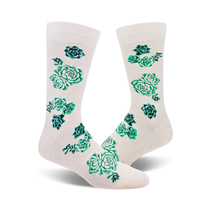 Pair of cream crew socks adorned with teal and green succulent plants. A fun and quirky design. }}