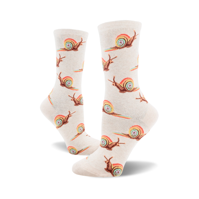 Pair of beige crew socks with repeating pattern of brown snails leaving rainbow trails. Fun, whimsical design.