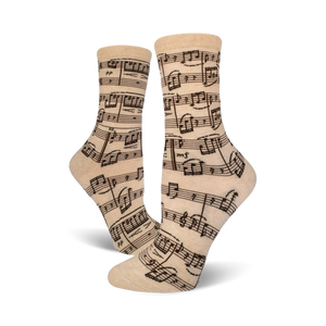 Close-up of beige crew socks with a musical notation print.  Dark brown notes on a beige background.
