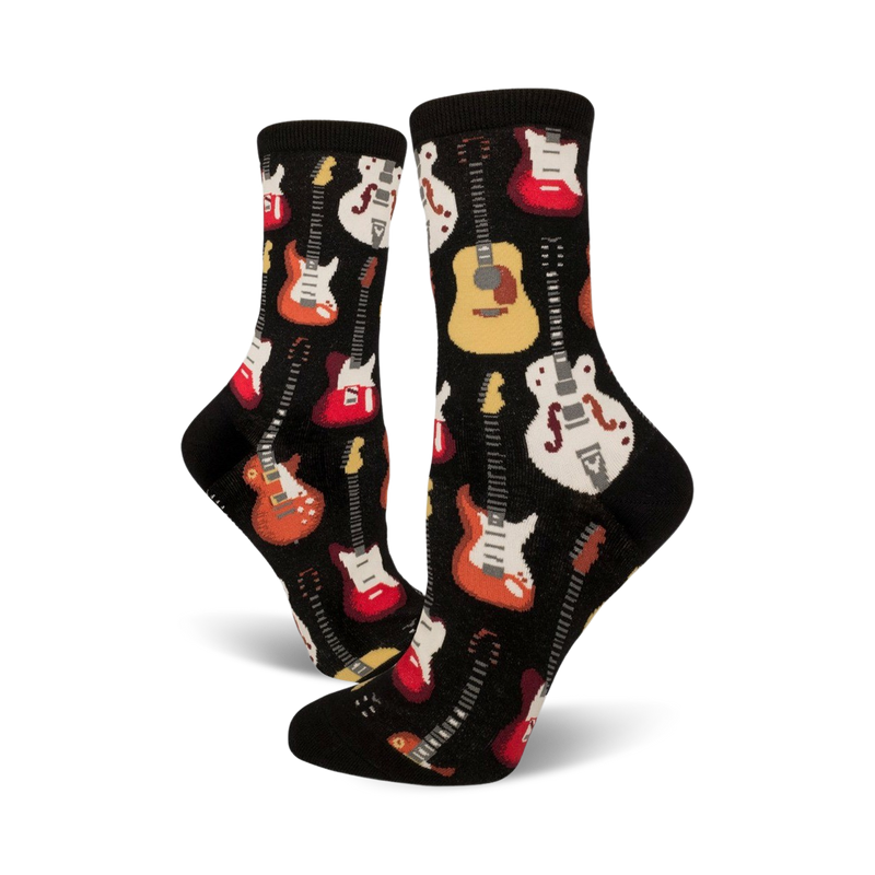 Pair of black crew socks with colorful guitar designs. Red, orange, white, and yellow guitars are printed on a black background.