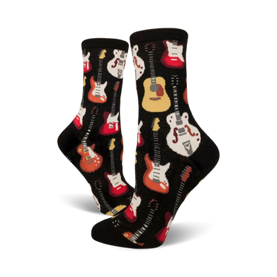 Pair of black crew socks with colorful guitar designs. Red, orange, white, and yellow guitars are printed on a black background.