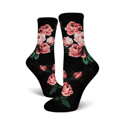 Pair of black crew socks with a pink rose pattern.  The roses are a blush pink with green leaves against a black background.