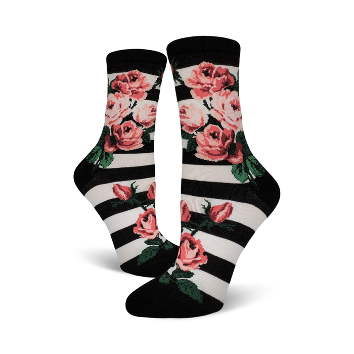 black crew socks with white horizontal stripes and pink rose design. women's socks with botanical theme.   