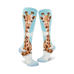 Pair of women's knee-high socks. Light blue background with a whimsical giraffe design in shades of brown and tan.
