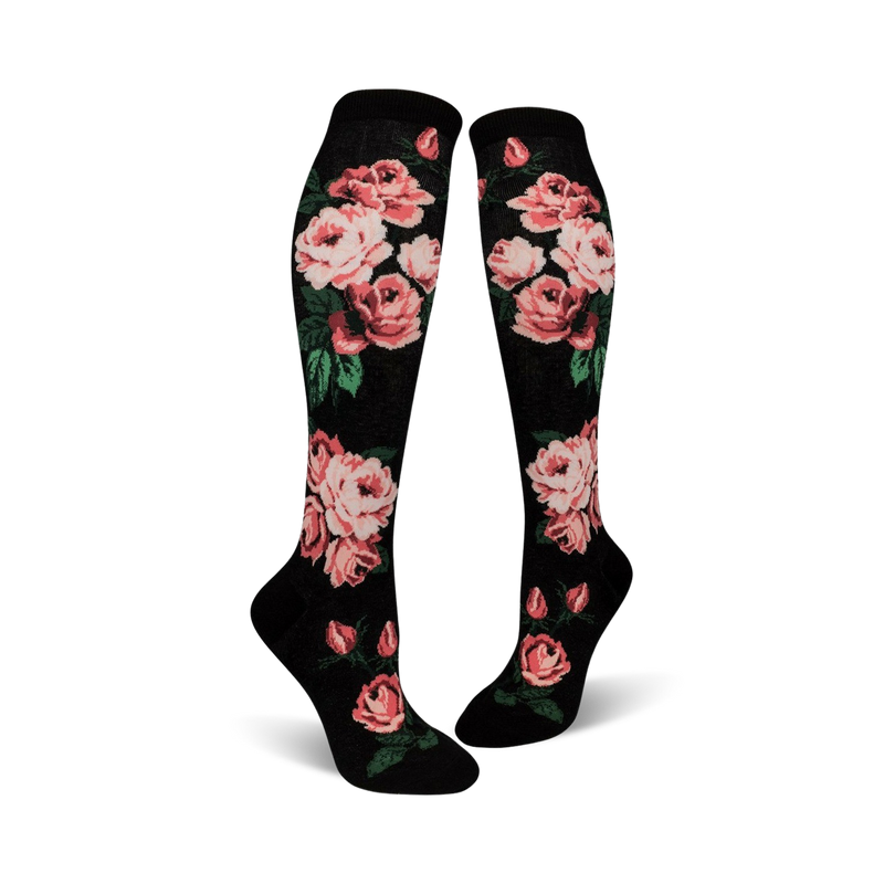 Pair of women's knee-high socks. Black background with pink roses and green leaves. One pair features black and white stripes.
