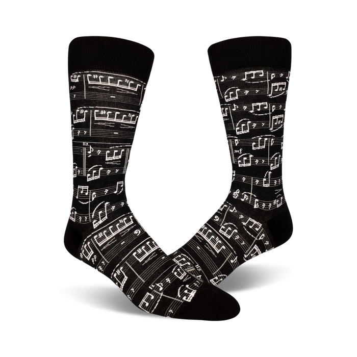 Pair of crew socks, black and beige options, featuring a printed musical score design.