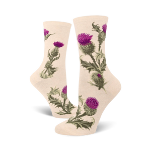 Cream crew socks adorned with a repeating pattern of purple and green thistles. Botanical illustration style.