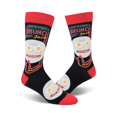 Pair of black crew socks with a red cuff. The design features a plate of eggs and bacon with the text 'Resting Brunch Face' and '24 hours'.