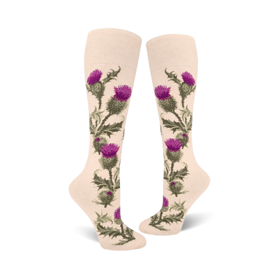 Pair of cream knee-high socks adorned with a vertical pattern of purple thistles and green leaves.