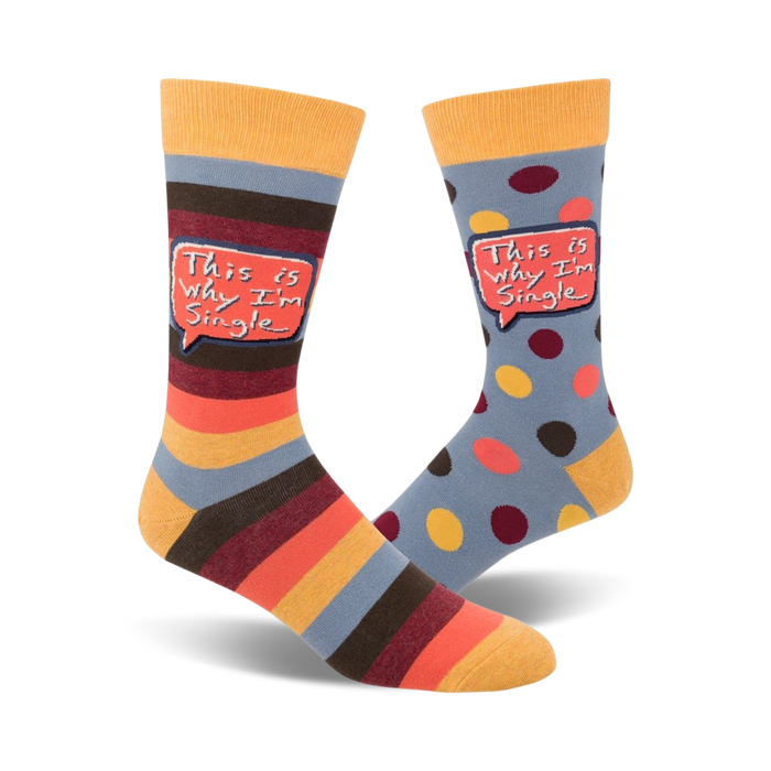 Crew socks in blue, orange, and brown. One sock has horizontal stripes, the other has polka dots. Both socks feature a speech bubble saying 'This is why I'm single'. }}