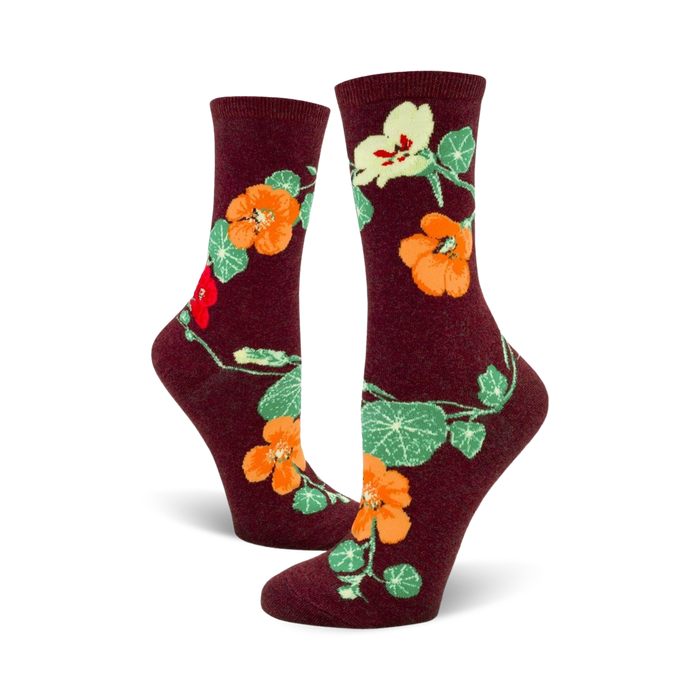 Lifestyle shot of a person wearing the burgundy nasturtium crew socks.