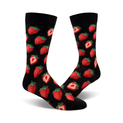 A pair of black crew socks with a red strawberry pattern. The strawberries are realistically rendered and scattered across the socks.