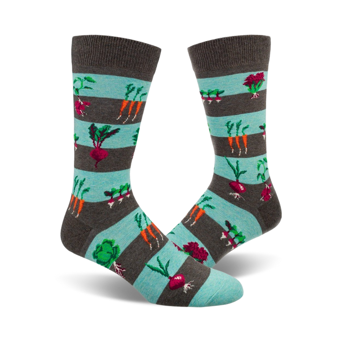 Pair of crew socks with teal and gray stripes.  The socks are adorned with colorful images of carrots, beets, radishes, and other garden vegetables. }}