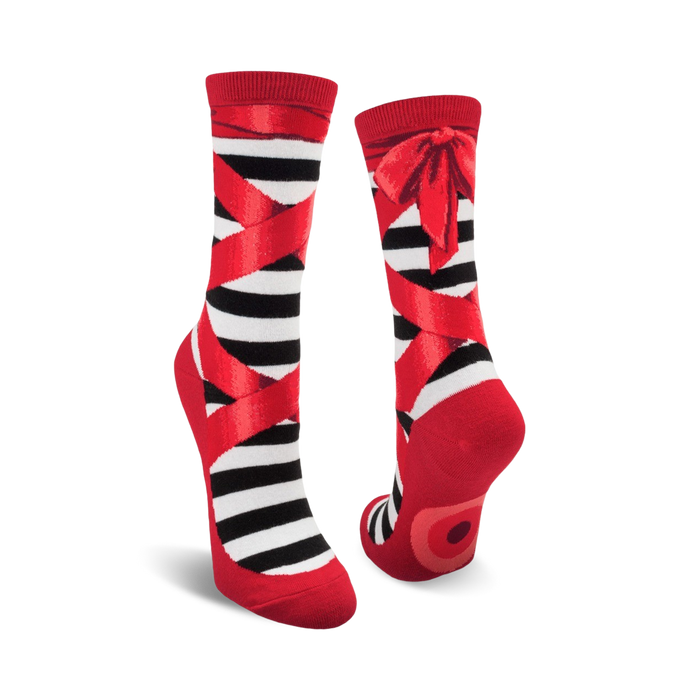 A pair of black and red striped ballet slipper socks with red ribbons and bows. Fun and whimsical design.