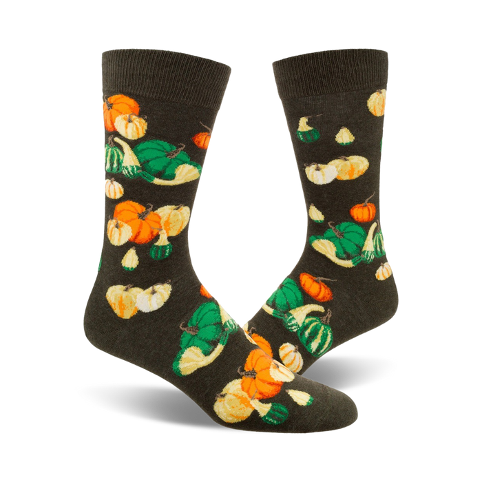 crew socks with a gourd and pumpkin pattern in shades of orange, yellow, and green on a dark background. perfect for fall.   }}