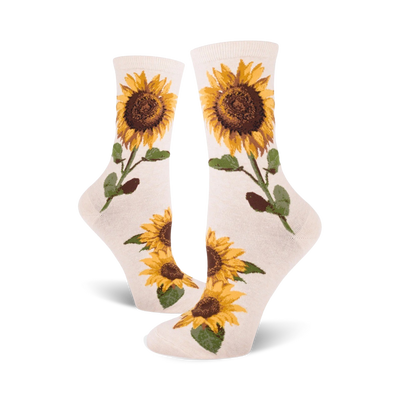 Cream crew socks with yellow and brown sunflower designs.  Sunflowers are depicted with stems and leaves on a cream background.
