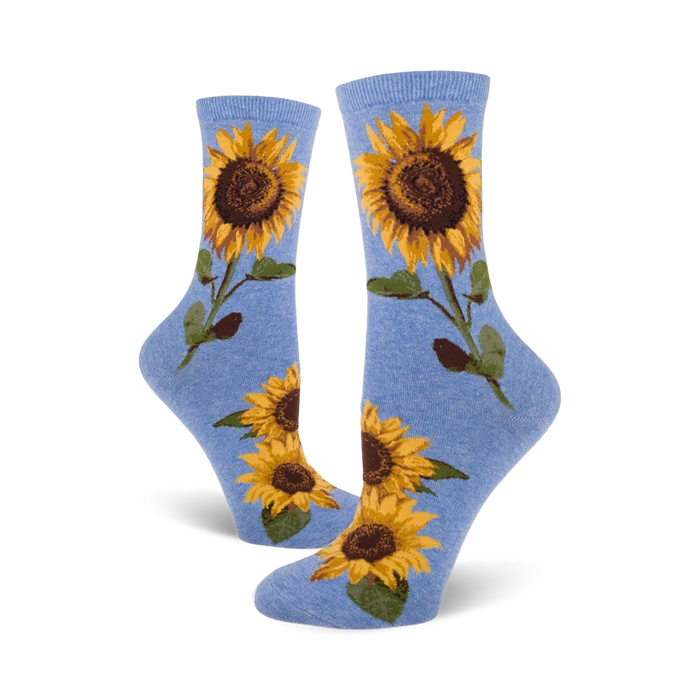 blue crew socks featuring a cheerful pattern of vibrant yellow sunflowers with brown centers and green leaves, designed for women.   