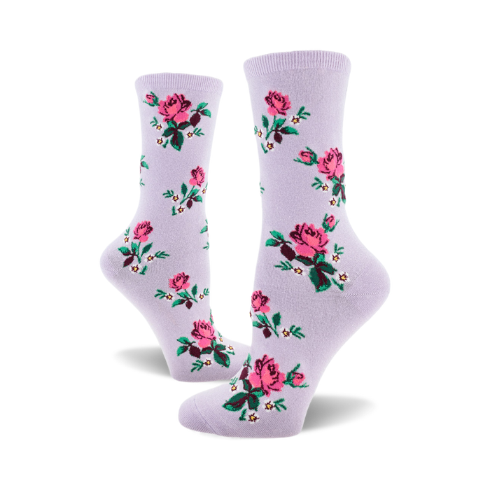 socks that are purple with a pattern of pink roses, green leaves, and white flowers. }}