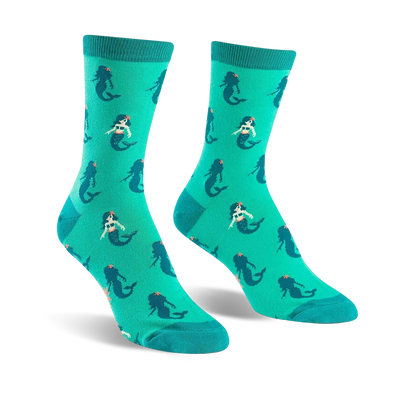 Pair of teal crew socks featuring a repeating pattern of cute cartoon mermaids.