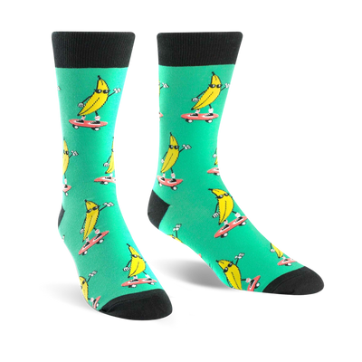 Crew socks in teal with a repeated pattern of yellow bananas skateboarding. Bananas wear sunglasses.