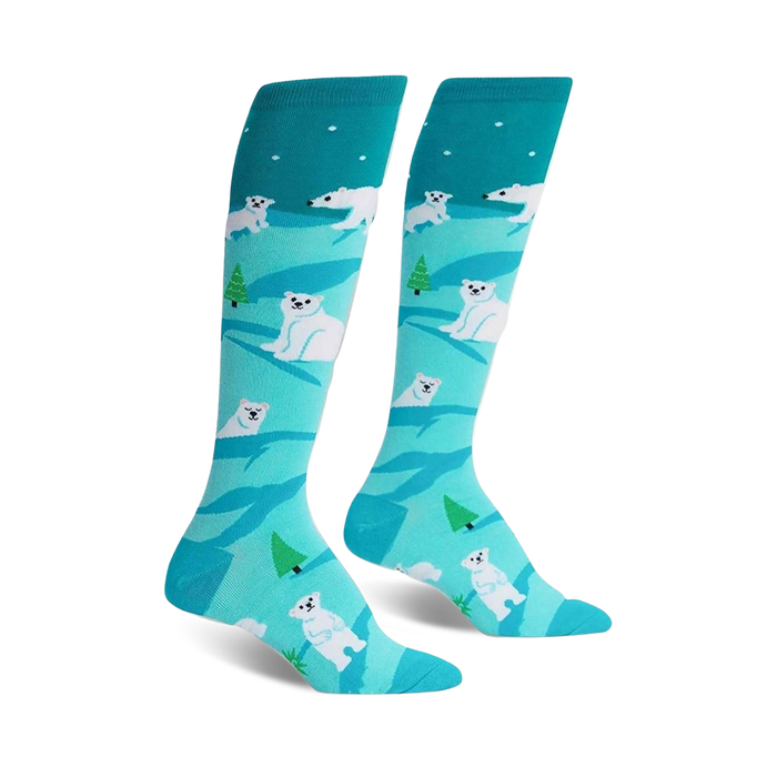 Pair of teal knee-high socks with a whimsical design of white polar bears and small green trees on a light blue background. }}