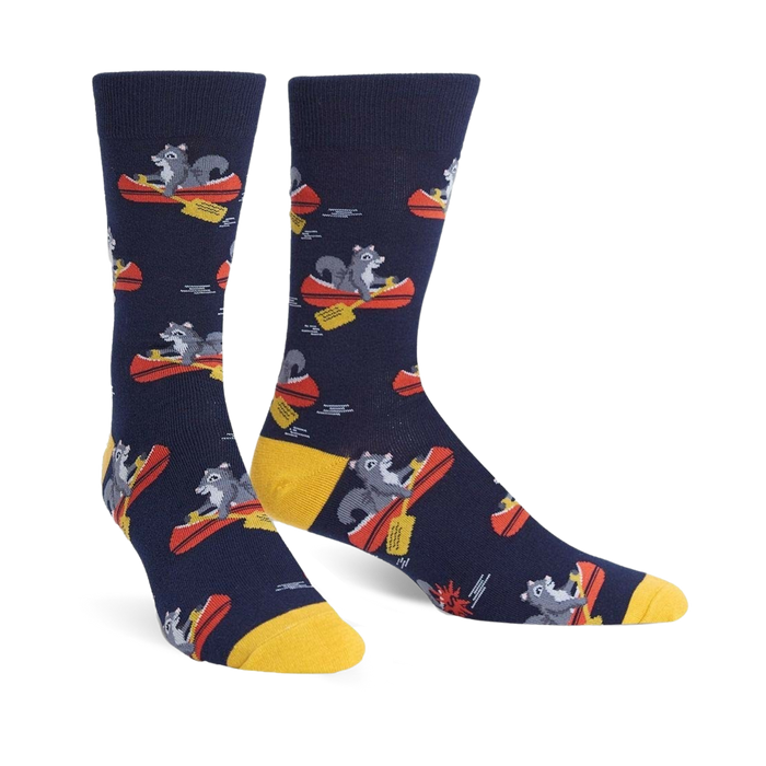 Crew socks in navy blue, featuring a repeating pattern of gray squirrels paddling red canoes. Yellow cuffs add a pop of color. }}