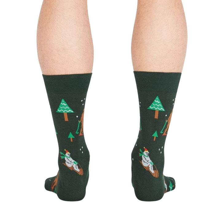 Rear view of the 'Ready, Yeti, Go!' socks showcasing the full design detail on a dark green background.