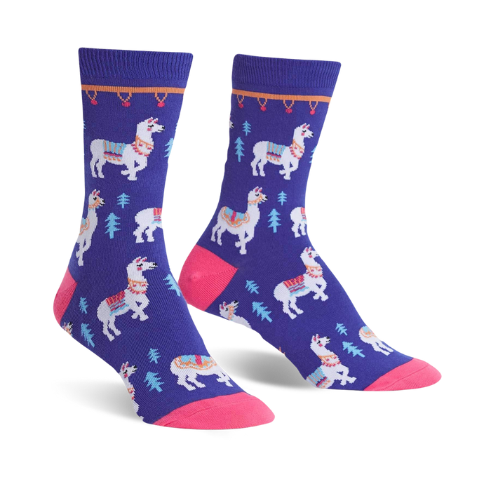 Pair of purple crew socks featuring white llamas with colorful saddles and small green trees. Pink toe and cuff detail. }}