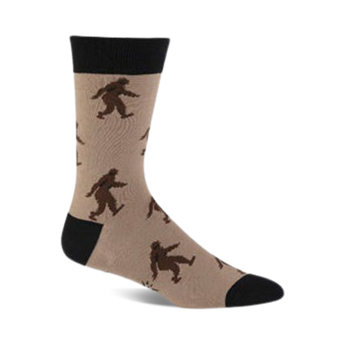Tan crew socks with a repeating pattern of brown Sasquatch figures. Black cuff. }}