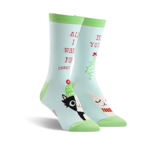 Pair of crew socks in teal green featuring a black and white cat, a llama wearing a scarf, mistletoe, and the text 'All I want for Christmas is you!'