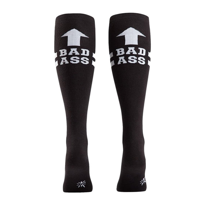 Rear view of a pair of black 'Bad Ass' knee-high socks on a person's legs.